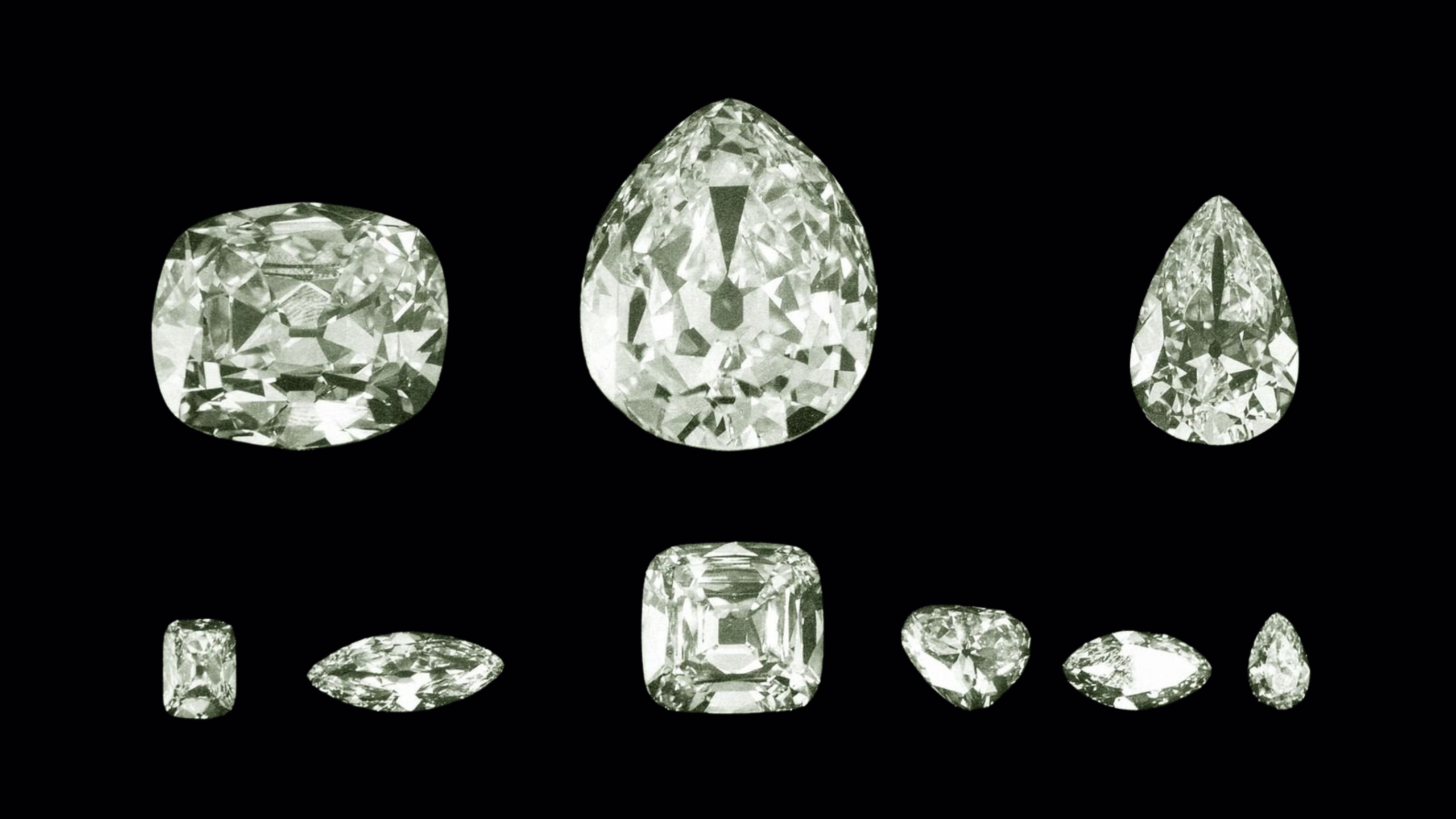 Image des 9 diamants taillés à partir du Cullinan, le plus gros diamant brut jamais découvert, montrant leur éclat et leurs tailles uniques.