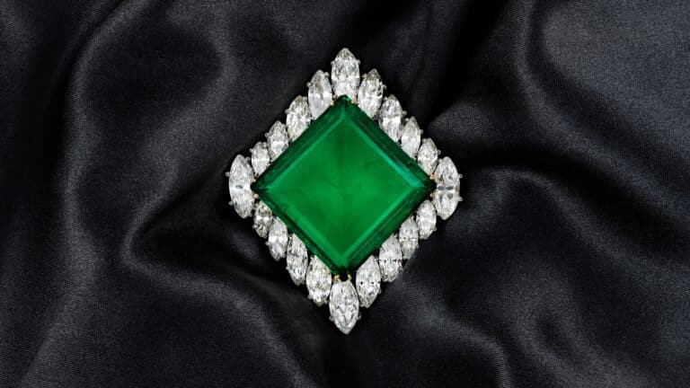 THE AGA KHAN EMERALDSENSATIONAL CARTIER EMERALD AND DIAMOND BROOCH