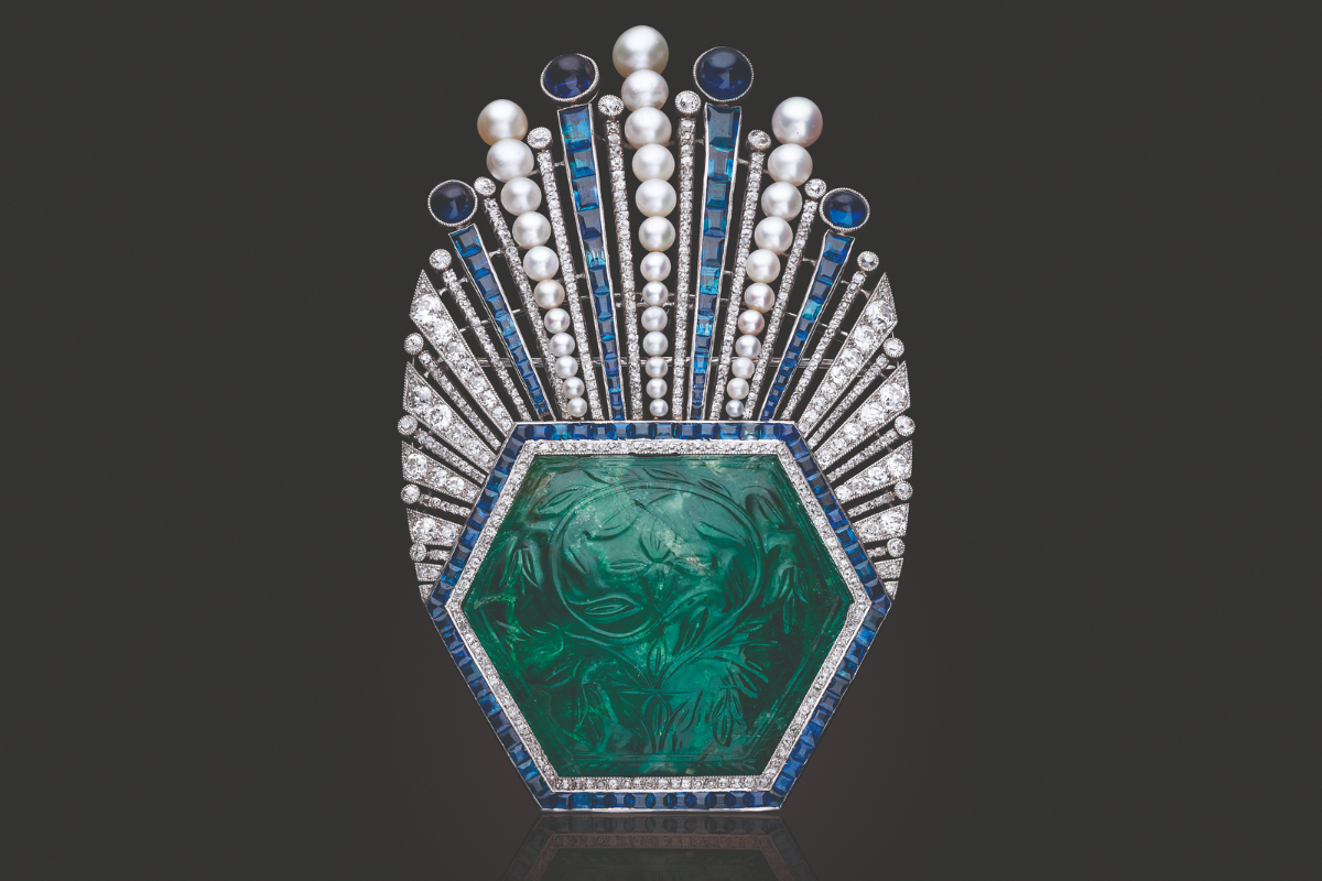 An Art Deco carved emerald, sapphire, diamond & pearl aigrette circa 1910 ©Christie's