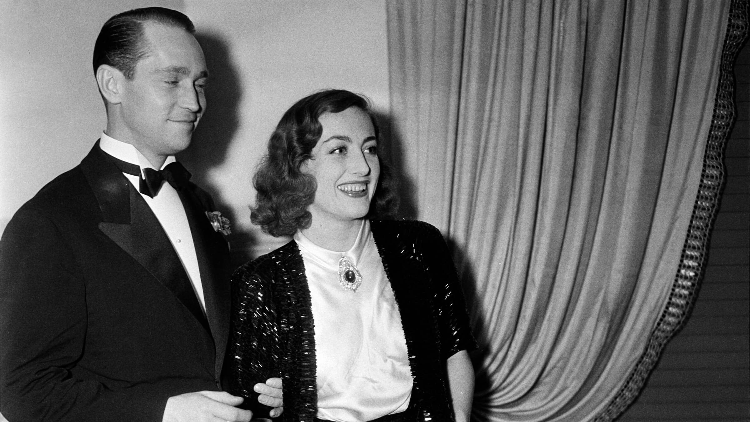 Joan Crawford wears a brooch