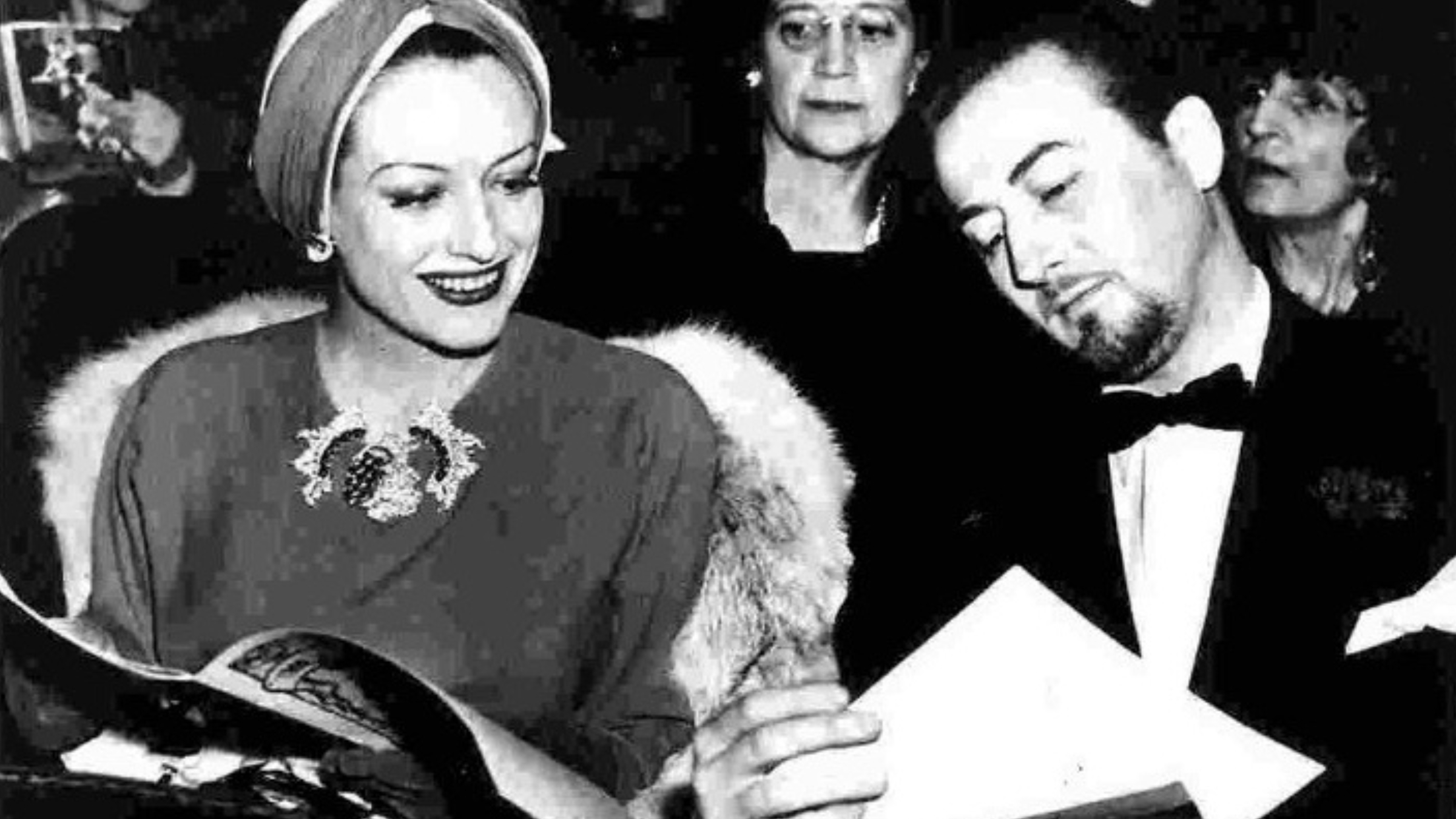 Joan Crawford wearing clips by Paul Flato