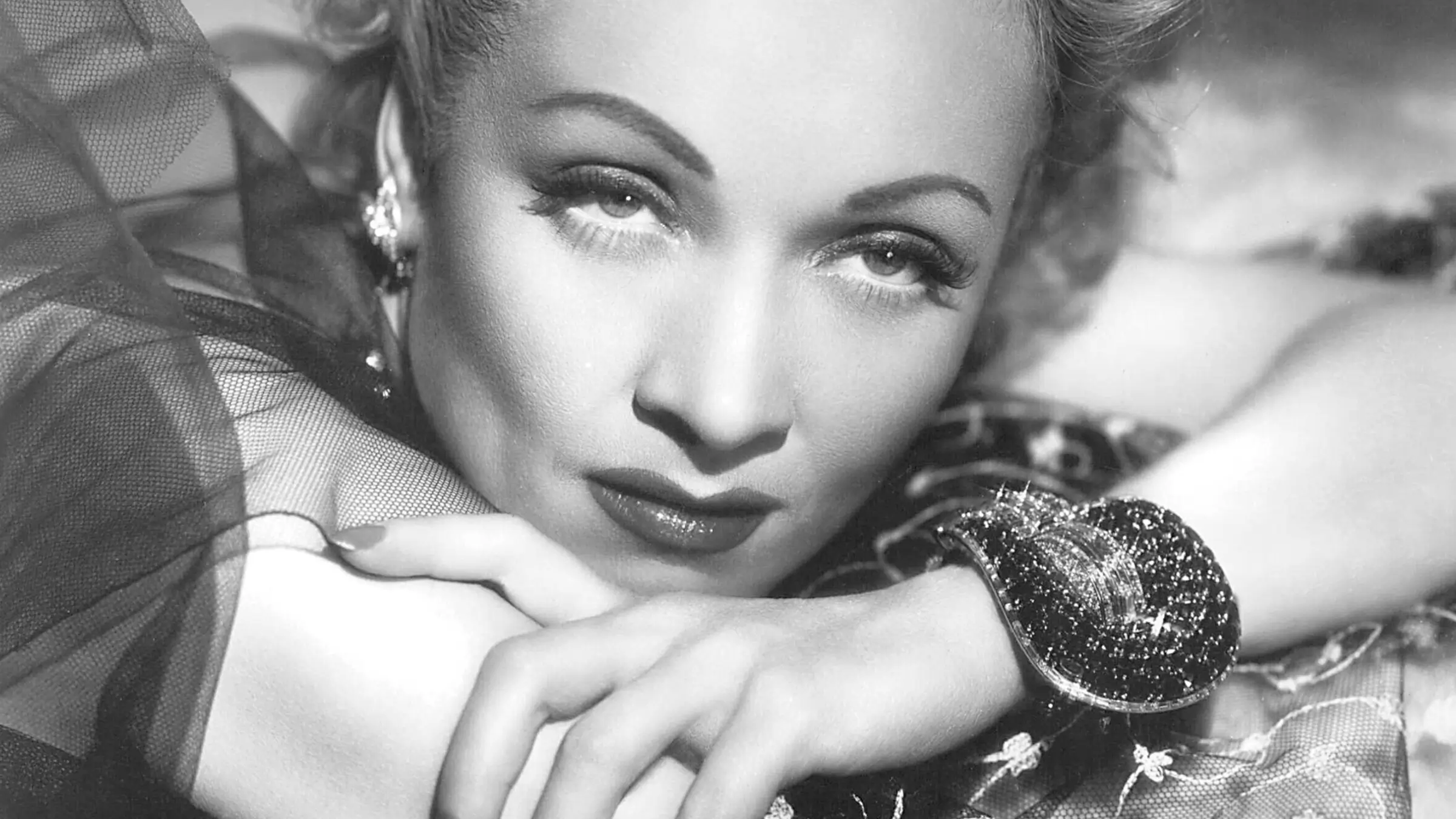 Marlène Dietrich with her bracelet by Van Cleef & Arpels